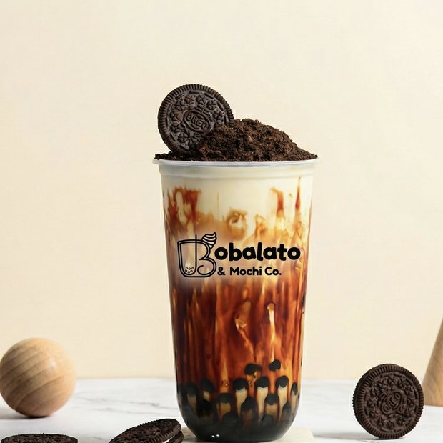 Cookies and cream brown sugar boba drink in a Bobalato cup